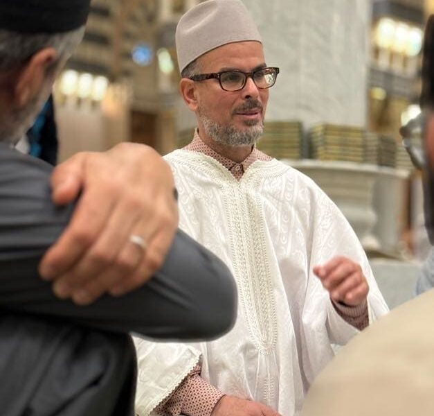 Tayseer faculty member in conversation inside the mosque