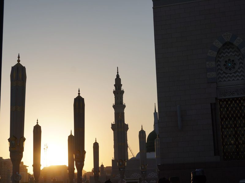 Mosque minarets silhouetted at sunset